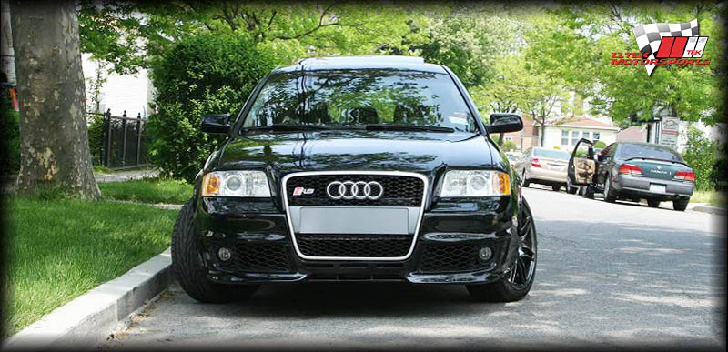Photo of an Audi A6 C5 with RS Six Look Bumper, OEM Grill and Hood Extension installed.